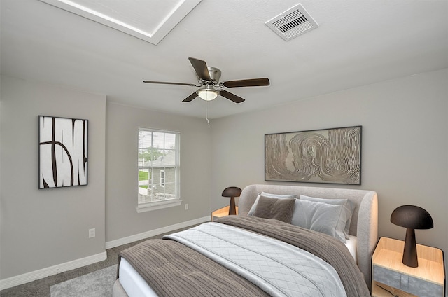 bedroom with ceiling fan and light colored carpet