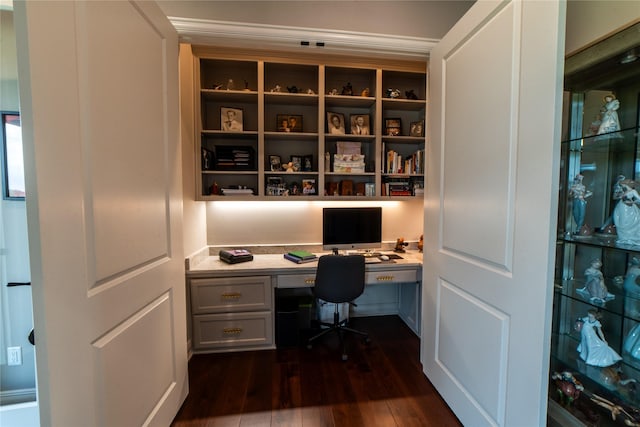 office area with dark hardwood / wood-style flooring and built in desk