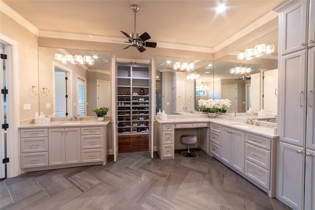 bathroom featuring parquet floors, vanity, ceiling fan, and crown molding