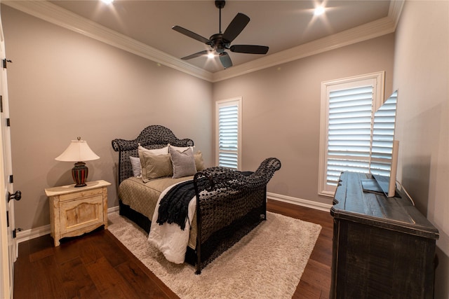 bedroom featuring ceiling fan, ornamental molding, and dark wood-type flooring