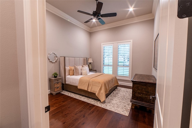 bedroom featuring ceiling fan, crown molding, and dark hardwood / wood-style floors