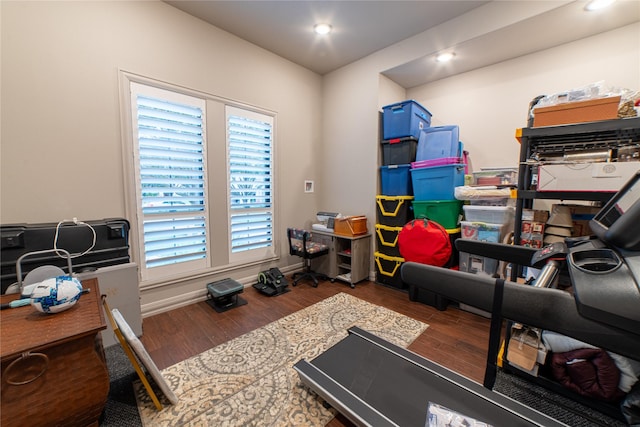 exercise room featuring dark hardwood / wood-style floors and a wealth of natural light