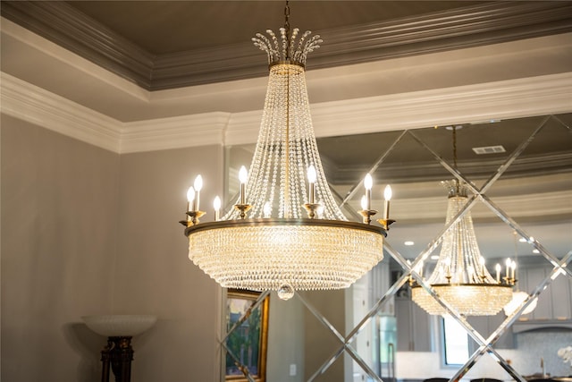 room details featuring a notable chandelier and ornamental molding