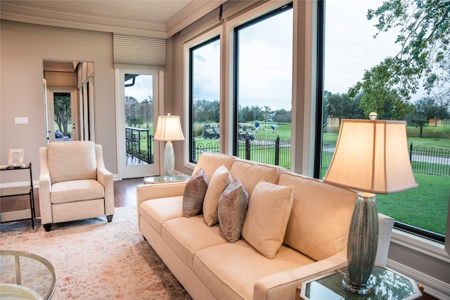 interior space with hardwood / wood-style flooring and crown molding