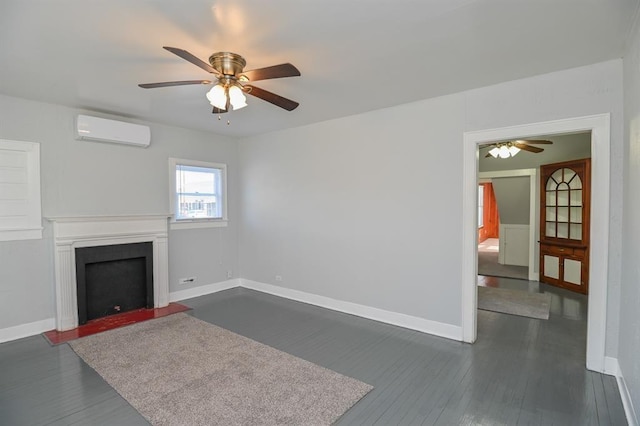 unfurnished living room with a wall mounted AC, ceiling fan, and dark hardwood / wood-style flooring