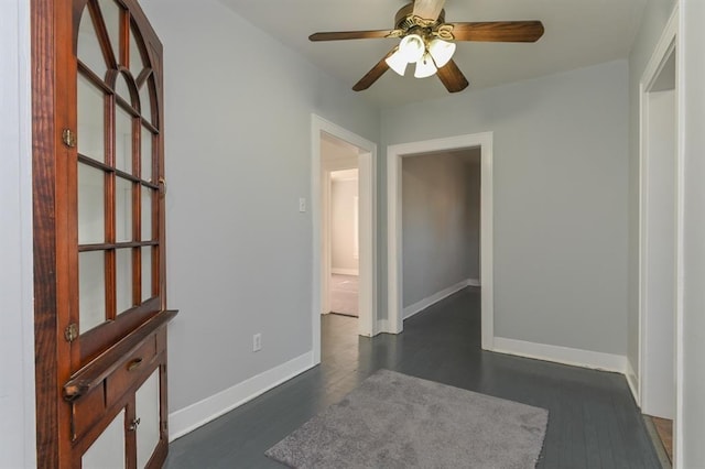 spare room featuring dark hardwood / wood-style floors and ceiling fan