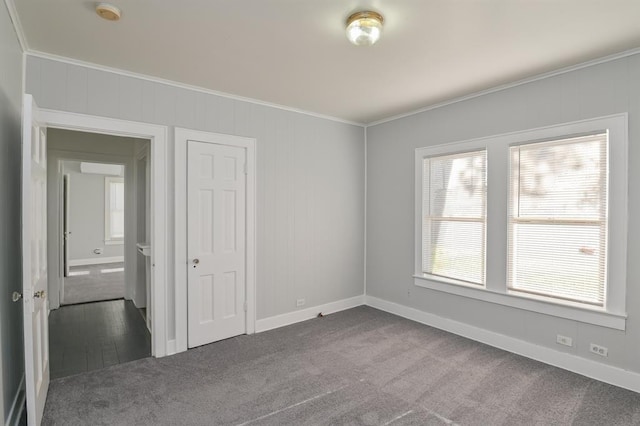 unfurnished room with carpet and ornamental molding