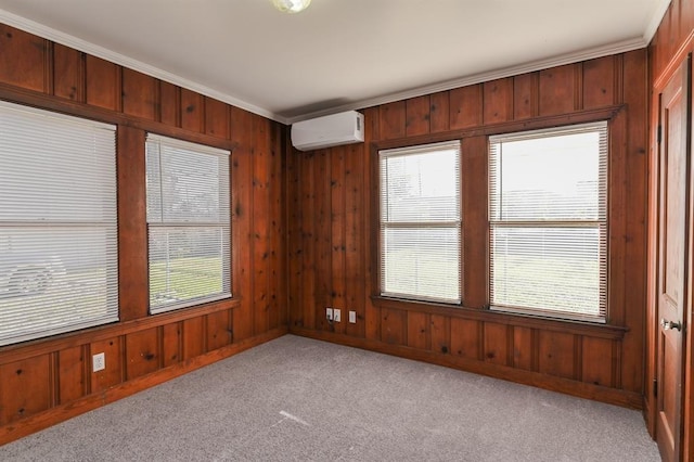 carpeted empty room featuring a wall mounted air conditioner, ornamental molding, and wood walls