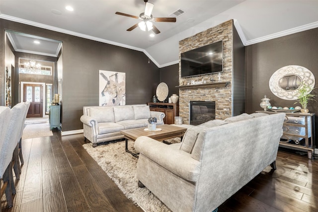 living room featuring vaulted ceiling, ceiling fan, ornamental molding, a fireplace, and dark hardwood / wood-style flooring