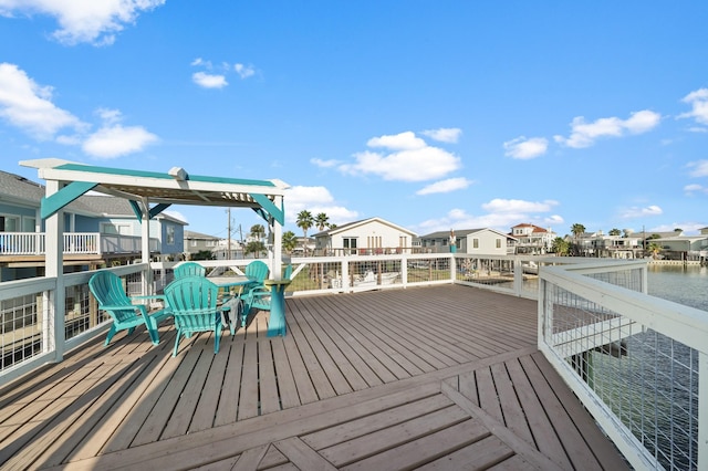 wooden terrace with a water view