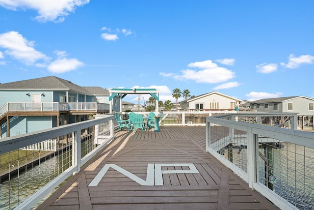 exterior space with a deck with water view