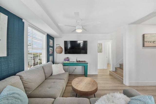 living room featuring ceiling fan and light wood-type flooring