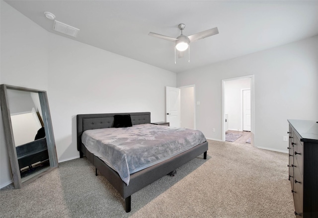 bedroom featuring ceiling fan and light carpet