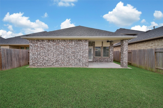 back of property featuring ceiling fan, a patio, and a yard