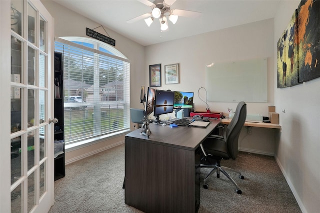 home office with a wealth of natural light, light carpet, french doors, and ceiling fan