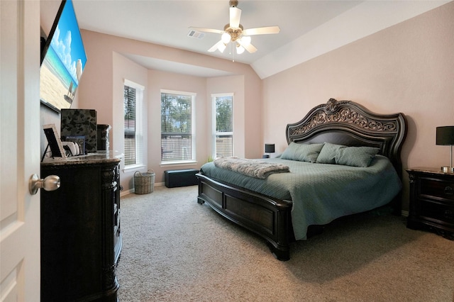 bedroom with carpet flooring, ceiling fan, and vaulted ceiling