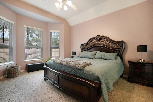 bedroom featuring ceiling fan, lofted ceiling, light carpet, and multiple windows