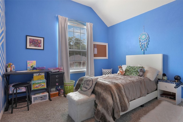 bedroom with carpet floors and vaulted ceiling