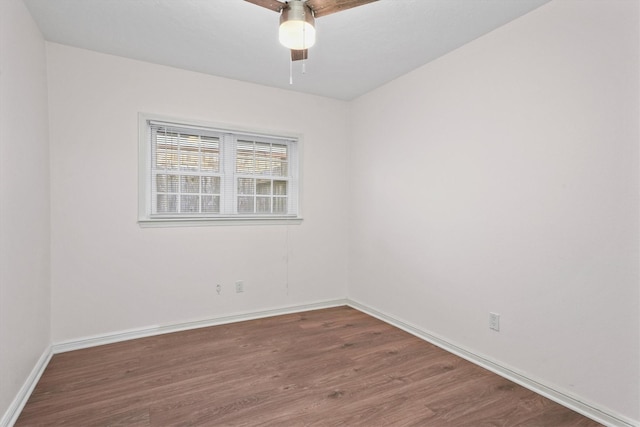 spare room with ceiling fan and wood-type flooring