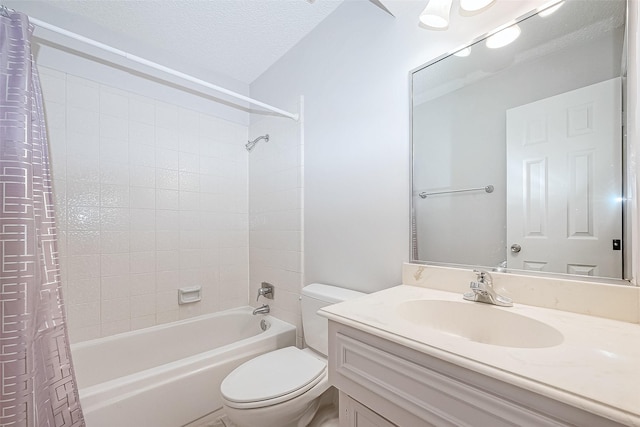 full bathroom featuring vanity, shower / bath combination with curtain, a textured ceiling, and toilet