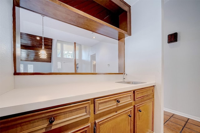 bathroom with tile patterned floors and vanity