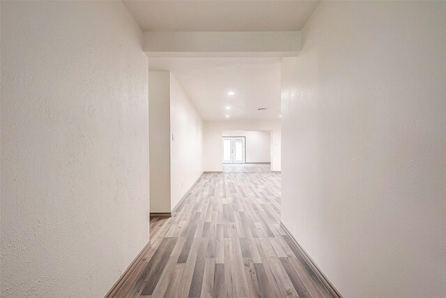 hall with light hardwood / wood-style flooring