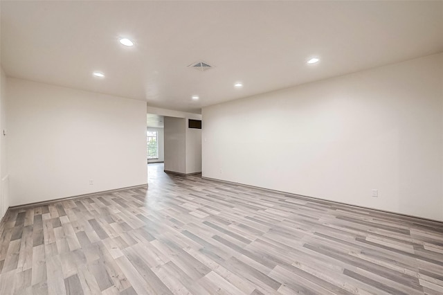 unfurnished room with light hardwood / wood-style floors