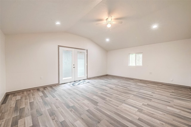 bonus room with ceiling fan, french doors, vaulted ceiling, and light wood-type flooring