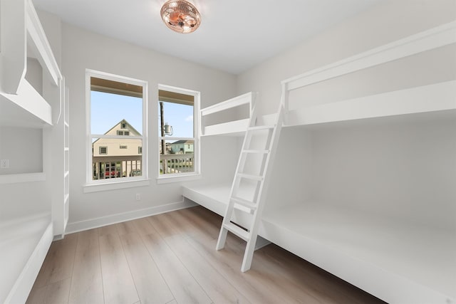 unfurnished bedroom featuring light wood-type flooring