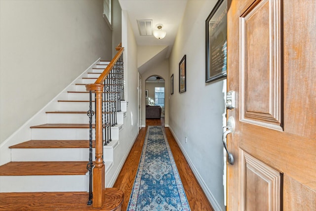 foyer with dark hardwood / wood-style floors