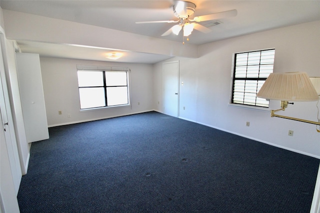 unfurnished room with carpet floors and ceiling fan