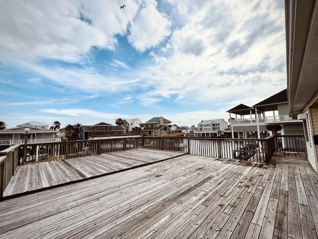 wooden deck featuring a water view