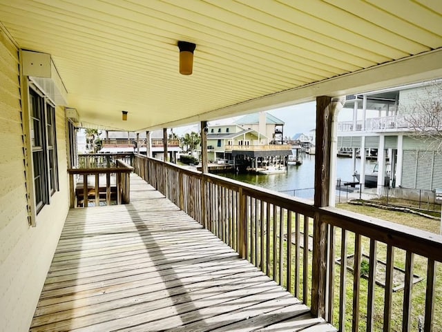 wooden deck featuring a water view