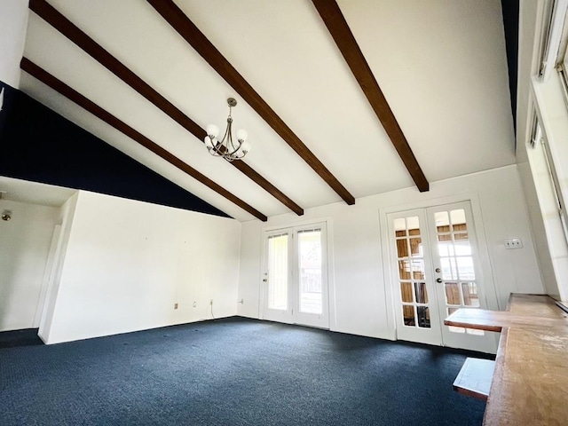 unfurnished living room with beam ceiling, french doors, a notable chandelier, and dark carpet