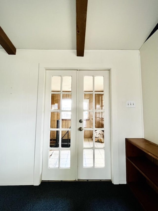 doorway with carpet, french doors, and beamed ceiling