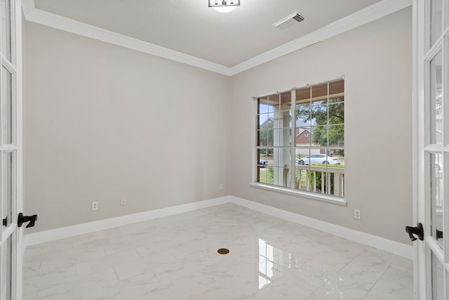 unfurnished room with a wealth of natural light, crown molding, and french doors