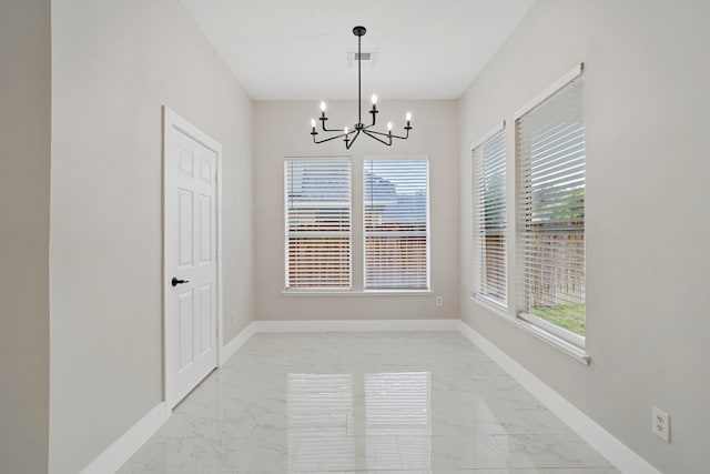 interior space featuring an inviting chandelier