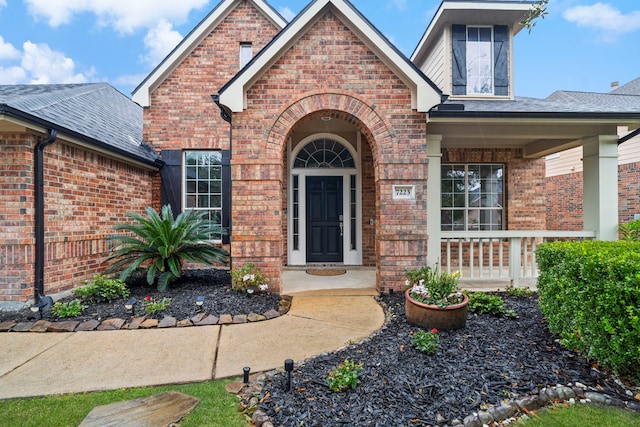 doorway to property with a porch