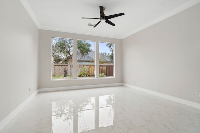 spare room with ceiling fan and crown molding