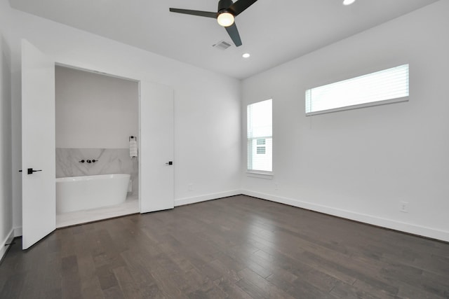 unfurnished room with ceiling fan and dark hardwood / wood-style floors