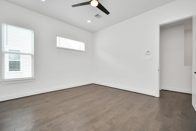 unfurnished room with dark hardwood / wood-style flooring and ceiling fan