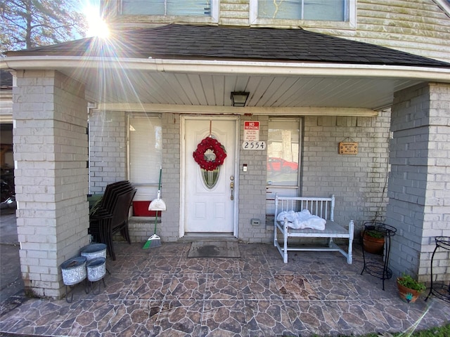 doorway to property with covered porch