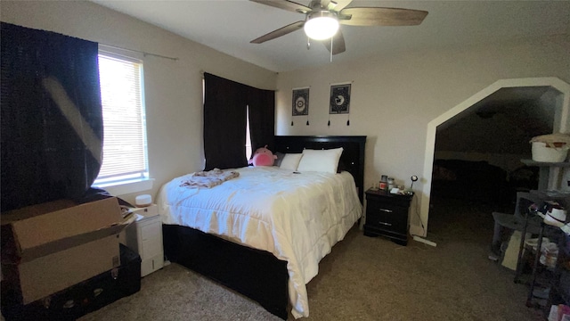 bedroom with ceiling fan and light colored carpet