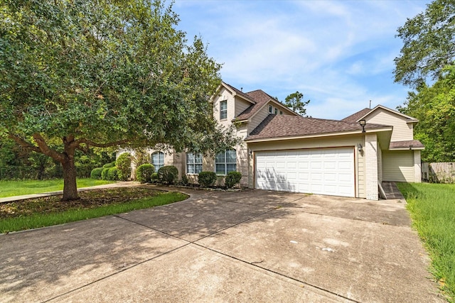 view of front of house featuring a front yard and a garage