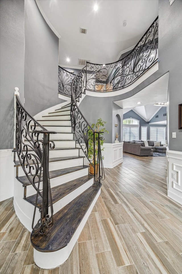 stairway featuring a high ceiling