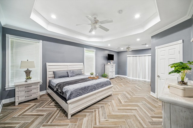 bedroom with a raised ceiling, ceiling fan, crown molding, and parquet floors