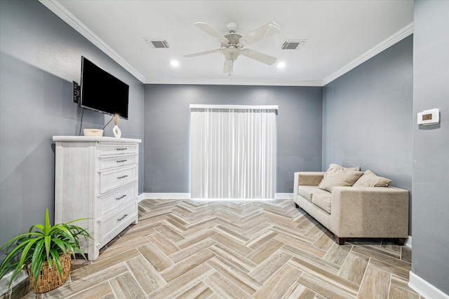 sitting room with light parquet flooring, ceiling fan, and crown molding