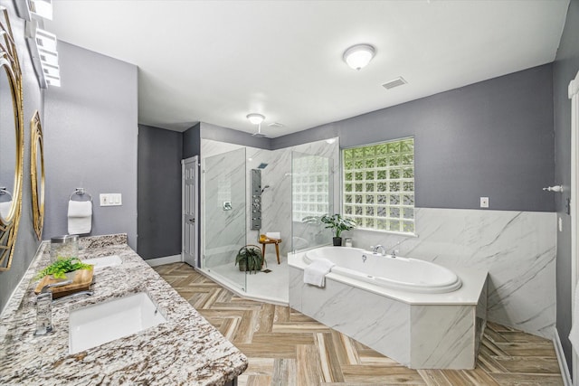 bathroom featuring vanity, parquet flooring, and plus walk in shower