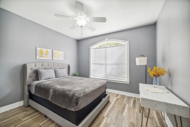 bedroom with ceiling fan and wood-type flooring