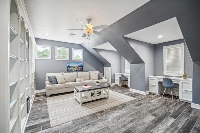 living room featuring built in desk, dark wood-type flooring, lofted ceiling, and ceiling fan